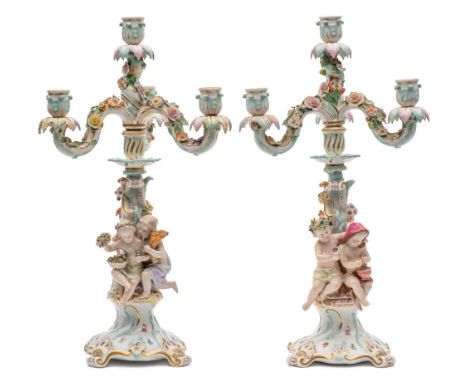 A pair of late 19th century Meissen porcelain four-light figural candelabra: representing the four seasons, each rocaille mou