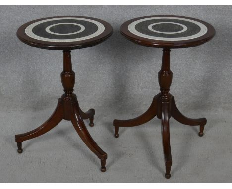 A pair of Colonial style occasional tables with carved and stained tops on tripod pedestal bases. H.54 D.36.5cm 