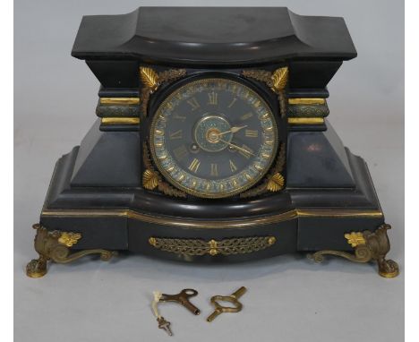 A 19th century French style mantel clock by Hamann and Koch with all over ormolu mounts on scrolling lion's paw supports with