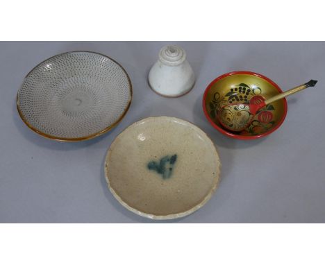 A collection of ceramics and lacquered items. Including two glazed ceramic plates one with linear incised pattern, a ceramic 
