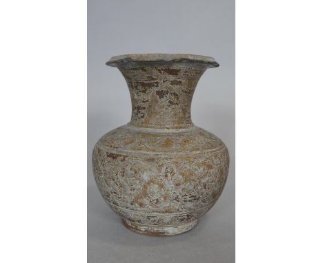 An Oriental ceramic glazed flared neck vase with stylised floral design. H.16.5cm 