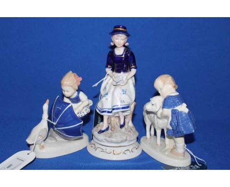 THREE GERMAN CERAMIC FIGURESto include a Child with Lamb, Child with Goose and a Seated Lady with bird.
