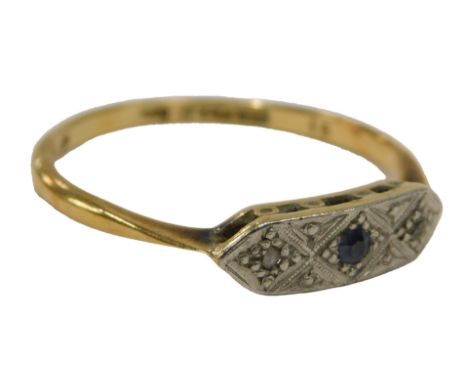 An Art Deco style dress ring, the oval ring head set with two tiny diamonds, and a sapphire, on a yellow gold band, stamped 1