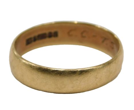 A 9ct gold wedding band, of plain design, Birmingham 1959, with internal inscription, ring size W, 3.6g.
