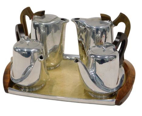 An unused and labelled Picquot ware tea and coffee service, tray with two wooden handles.