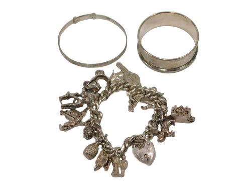 A group of silver jewellery, comprising a silver curb link charm bracelet, with heart shaped padlock, and various charms, a c