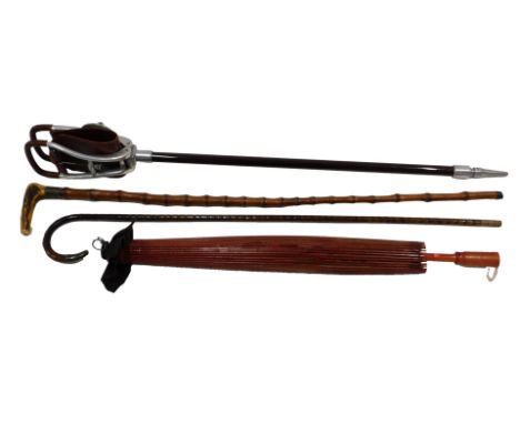 A William Mills Limited of Birmingham patent shooting stick, a bamboo walking stick with antler handle, a walking cane, and a