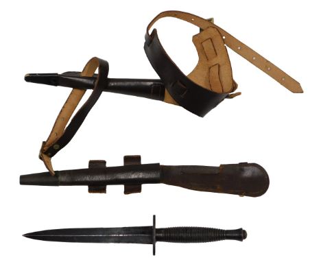 A Fairburn Sykes 3rd pattern commando fighting knife, the copper grip stamped 3 below arrow insignia and the pommel stamped w