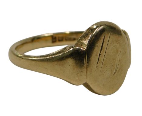 A 9ct gold signet ring, with oval shield, with rubbed decoration, ring size R, 7.2g all in.