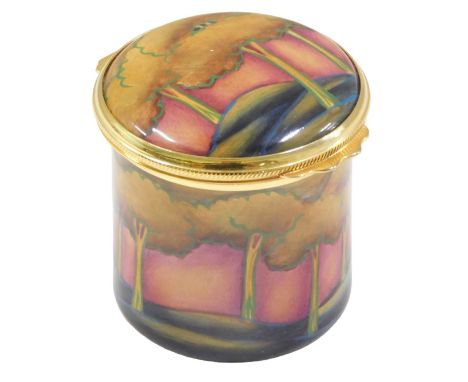A Moorcroft enamel box and cover, decorated with trees within a landscape, printed marks to underside, 4cm high.