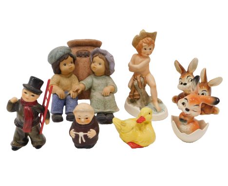 A quantity of Goebel figurines, to include nude child, rabbit in an egg shell, duck, rabbits, monk, and a pair of figures bes