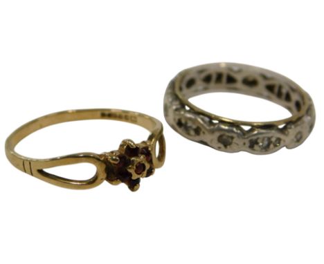 Two dress rings, comprising a 9ct gold garnet floral cluster ring, V splayed shoulders, ring size O½, and a 9ct gold and silv