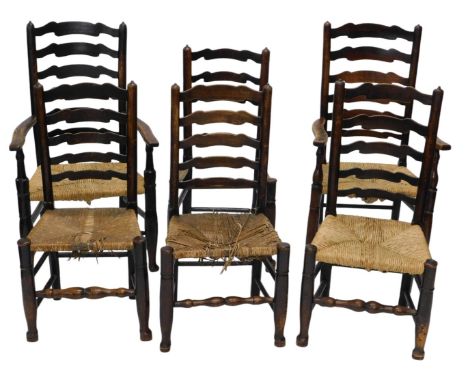 A composite set of six 19thC elm rush seated Lancashire style ladder back chairs, with rush seats, including two carvers.