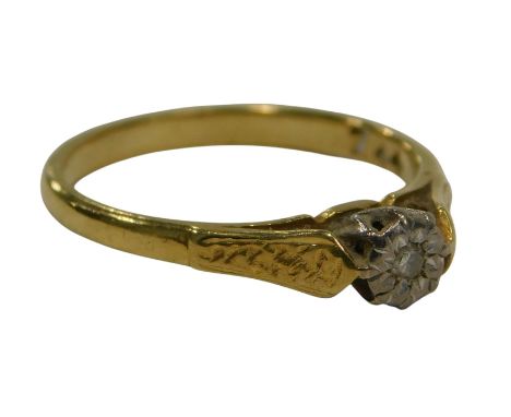 A diamond solitaire ring, the ring head set with tiny diamond illusion set in platinum on raised claw setting, yellow metal s