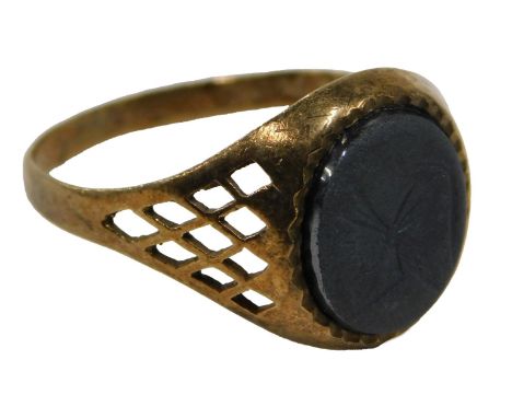 A 9ct gold lava cameo set dress ring, the oval lava panel depicting warrior, on a pierced shoulder design, ring size S½, 2.7g