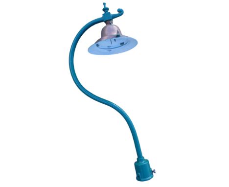 A cast green painted metal framed street lamp, with copper shade, 132cm high.