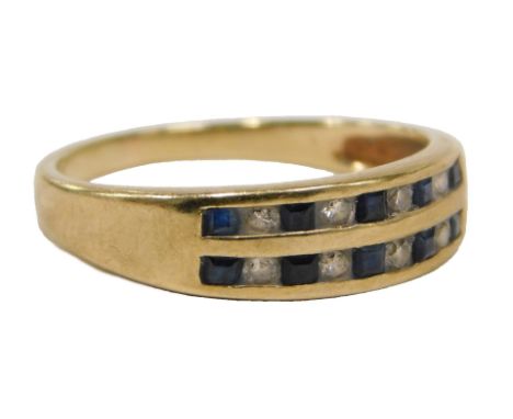 A 9ct gold dress ring, set with two rows of sapphires and diamonds, ring size L½, 1.9g all in.