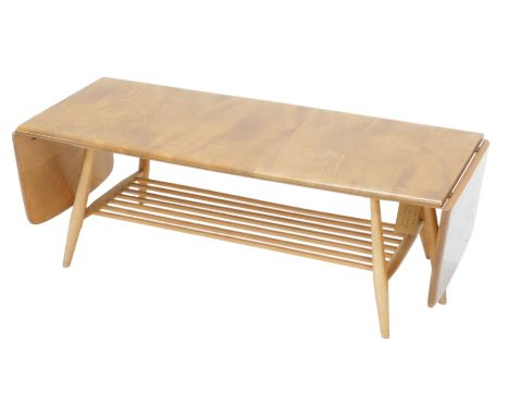 A light elm Ercol drop leaf coffee table, with turned legs and undertier, 158cm wide.