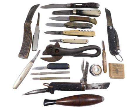 Various penknives, a bull shaped metal tin opener, a cigar shaped pipe, etc.