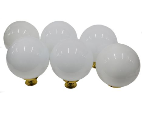 A set of six Christopher Wray light fittings, each with a white opaque globe shade, and brass fitting, 30cm high.