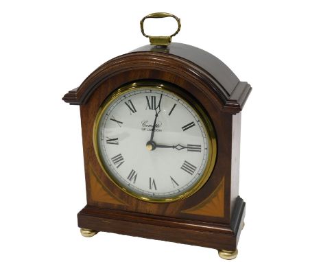 A Comitti of London mahogany mantel clock, with boxwood fan inlay, on brass bun feet, 28 day movement, 18cm high, 15cm wide, 