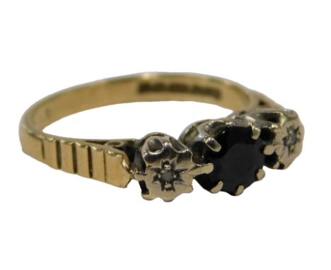 A 9ct gold three stone dress ring, set with sapphire and two tiny diamonds, each illusion star set, in platinum, on a yellow 