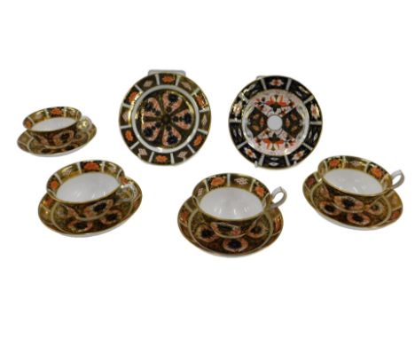 A Royal Crown Derby Imari pattern part tea service, comprising four cups and saucers and two plates.