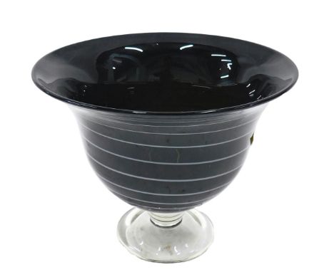 A deep green and red Art Glass bowl, with white banded decoration on a clear glass foot, 26cm diameter.