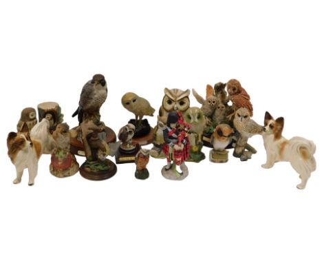 A quantity of ceramic and other owl figurines, to include Royal Doulton Peregrine Falcon, etc.