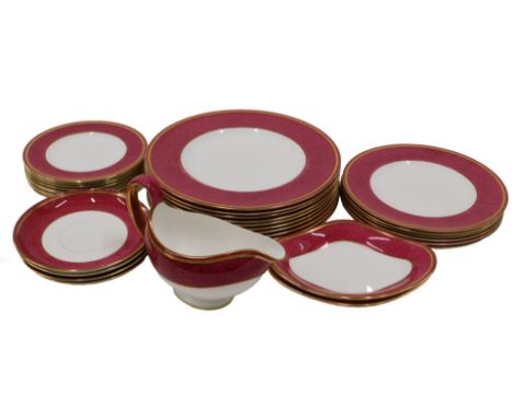 A Wedgwood part dinner service, each piece decorated with a mottled dark pink band, printed marks to underside.