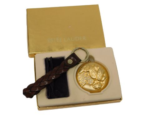 An Estee Lauder February powder compact, in fitted case, and a leather key ring bearing Mulberry stamp.