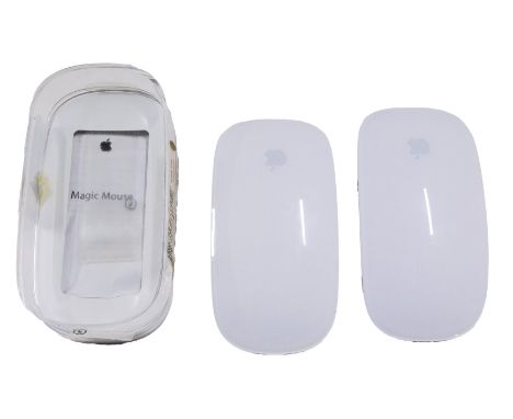 Two Apple Magic Mice, one boxed.