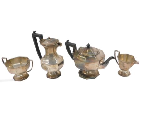 A silver plated Art Deco style teapot, with octagonal teapot, hot water jug, milk jug and sugar bowl.