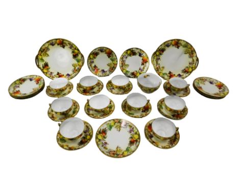 A Continental eggshell porcelain part tea service, decorated with fruit and leaves, on a blush ivory ground, to include two c
