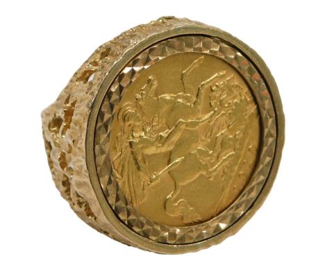 An Edward VII half gold sovereign dress ring, dated 1910, bark effect pierced shoulders, ring size L, 10.5g all in.