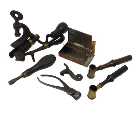 A 19thC shotgun cartridge loader, etc., including mounted iron and brass shot gun cartridge loader, lead shot mould grips, tw