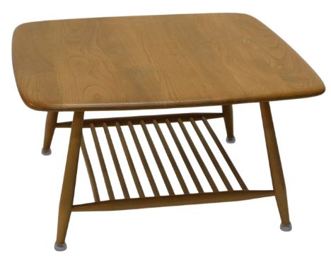 An Ercol light elm and beech coffee table, the rectangular top on turned supports, with slatted undertier, 41cm high, the rec