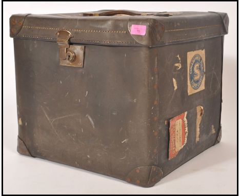 A vintage retro 20th century shipping trunk of cube form having original leather handle and brass lock and catch. Cunard Whit