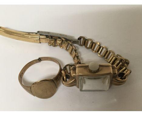 A 9carat gold ring weight 3.3g and a 9carat gold ladies watch. The bracelet strap roll gold. (2)  - NO RESERVE