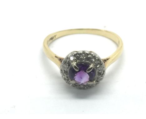 An 18ct gold, amethyst and diamond ring, approx 2.8g and approx size K-L.