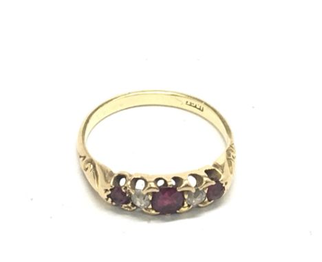 An 18carat gold ring set with ruby and small diamonds ring size Q. Weight 3.5g