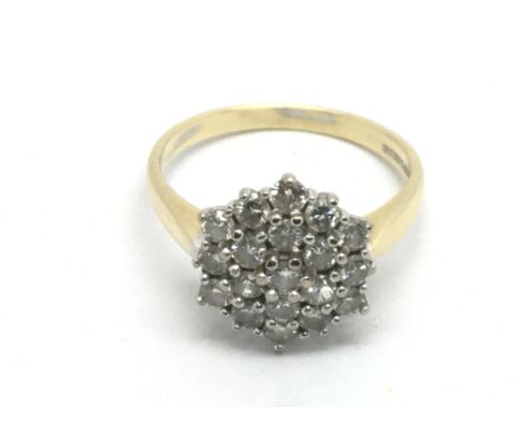An 18ct white gold diamond cluster ring, approx 4.5g and approx size P.