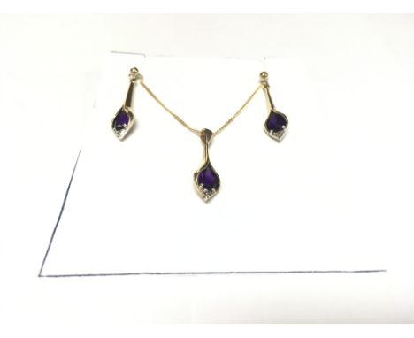 An amethyst and diamond suite consisting of earrings and pendant.