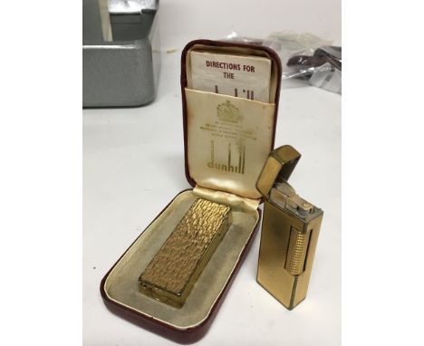 Two Vintage Dunhill lighters one in a fitted box with paperwork (2) used worn condition - NO RESERVE