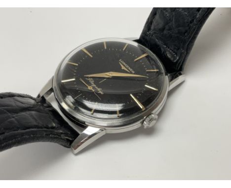 A vintage Longines black dial flagship model gents wristwatch, 18mm inc crown.