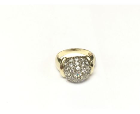 An unusual stone set pave done ring.