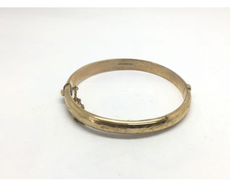 A 9ct gold bangle, approx 10.8g.
