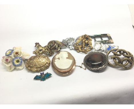 A collection of antique and Vintage brooch earrings s including a gold mounted Cameo brooch small enamel bat and butterfly br