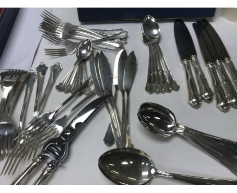 A comprehensive set of silver cutlery marked 800 including serving spoons fish knifes and forks tea spoons. Total weight for 