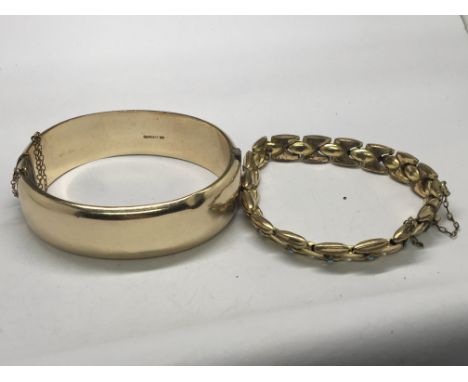A 1/5 9ct gold bangle and one other gold tone bracelet set with turquoise (2)